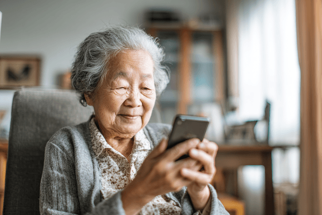 AI-generated illustrative image: A grandmother smiling while reading a message on her phone